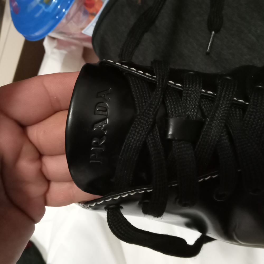 Prada Black Sneakers with Glossy Finish and Metallic Accents - Picture 5 of 7
